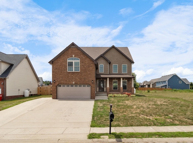 view of front of house featuring a front yard and a garage