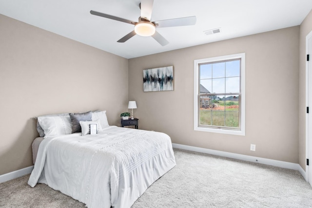 bedroom with light colored carpet and ceiling fan