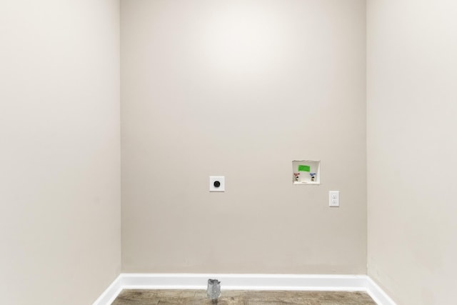 clothes washing area featuring carpet floors, electric dryer hookup, and hookup for a washing machine