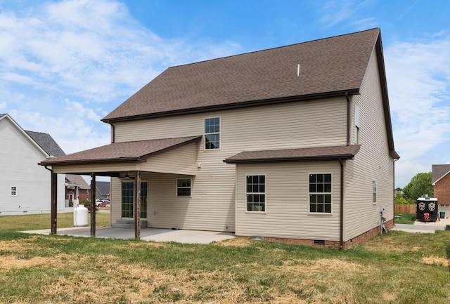 rear view of house with a patio area and a yard