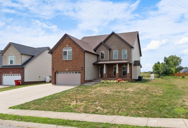 view of front of house with covered porch, a front yard, and a garage