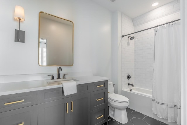 full bathroom with toilet, tile patterned flooring, shower / tub combo with curtain, and vanity