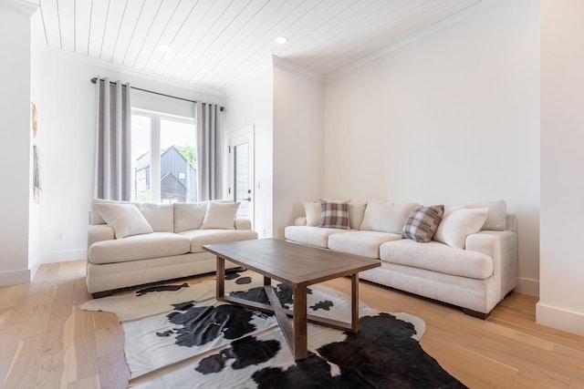 living room with light wood-type flooring, wood ceiling, and ornamental molding