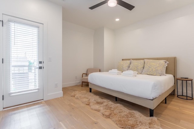 bedroom featuring ceiling fan and light hardwood / wood-style floors