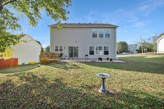 rear view of property with a patio area and a lawn