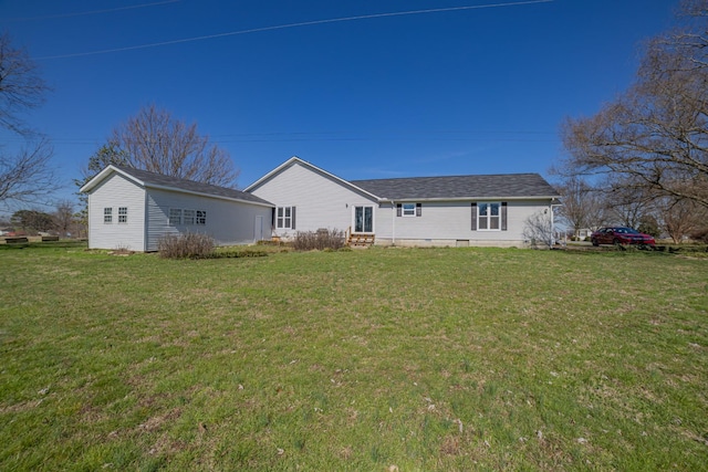 back of house with a yard