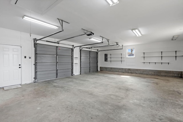 garage featuring a garage door opener