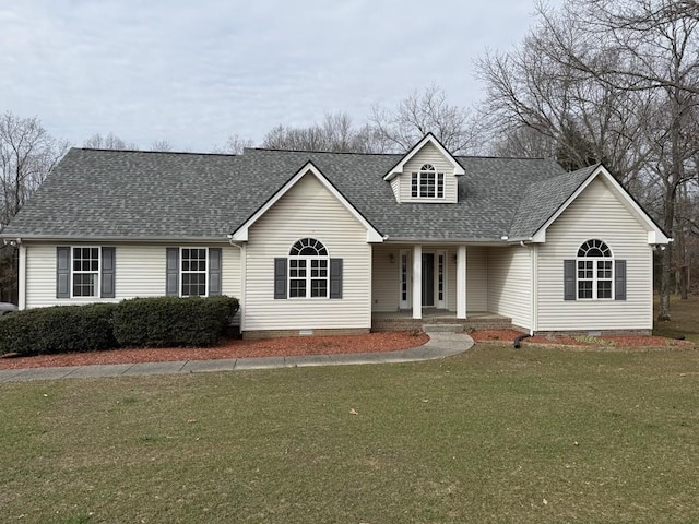 cape cod-style house featuring a front lawn and a porch