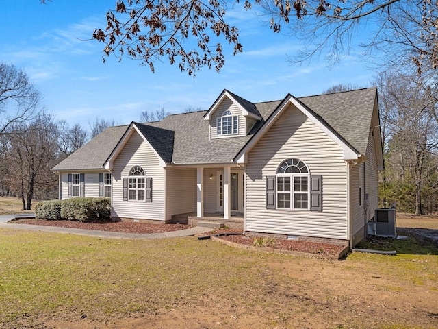 view of front of property featuring crawl space, a shingled roof, and a front lawn