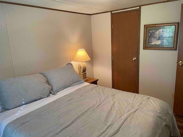 bedroom with crown molding