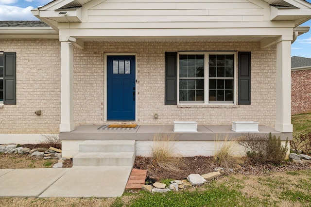 entrance to property featuring covered porch