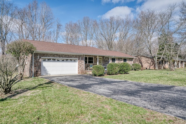 single story home featuring a garage and a front yard