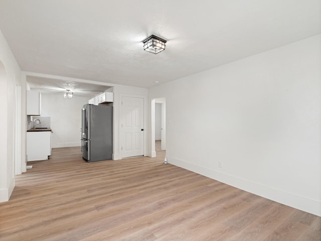 interior space with light wood-type flooring and sink