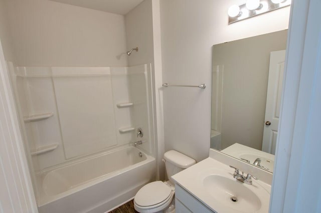 full bathroom featuring toilet, vanity, and tub / shower combination