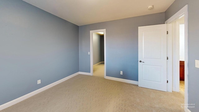 unfurnished bedroom with light carpet