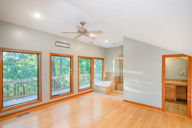 interior space with a healthy amount of sunlight, ceiling fan, and light hardwood / wood-style floors