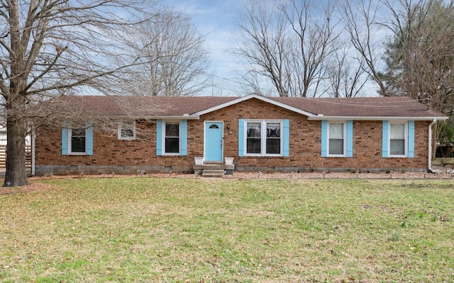 ranch-style home featuring a front yard