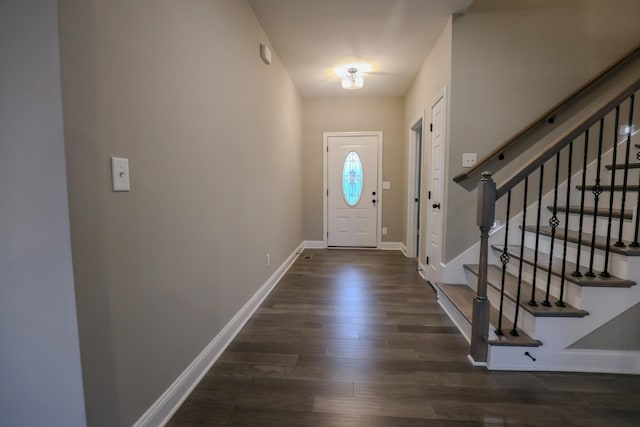 entryway with dark hardwood / wood-style floors