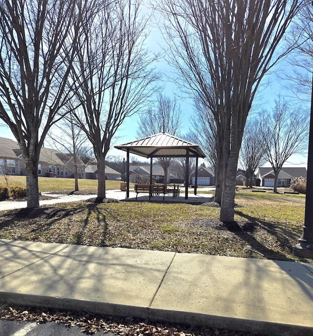 view of yard with a residential view and a gazebo