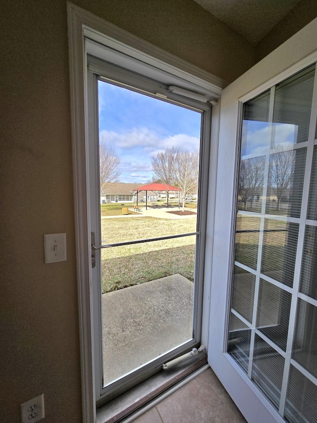 entryway with light tile patterned floors