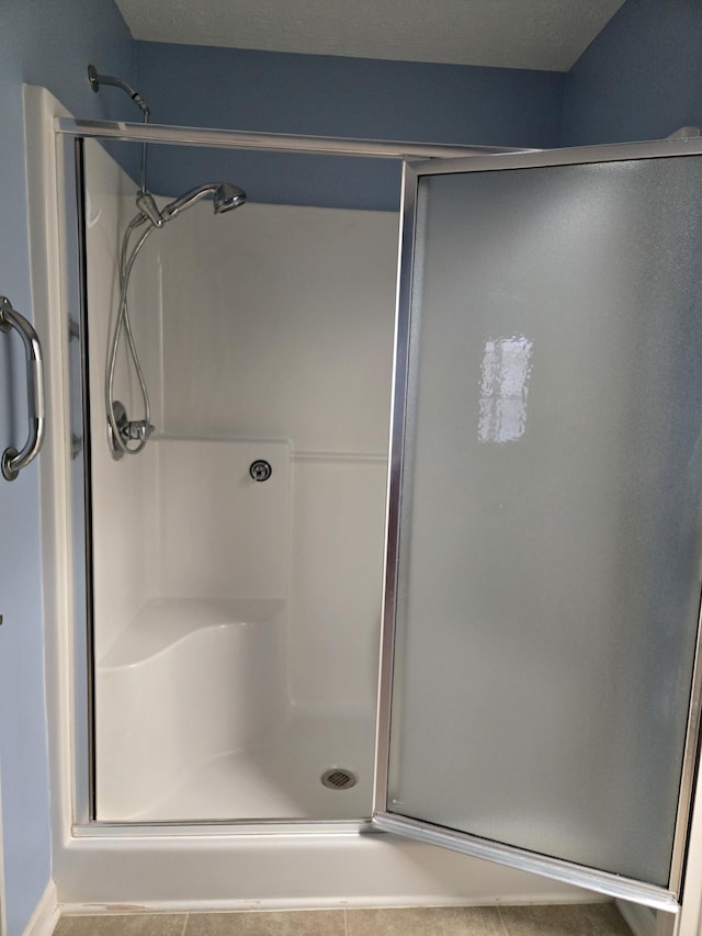 full bathroom featuring a stall shower