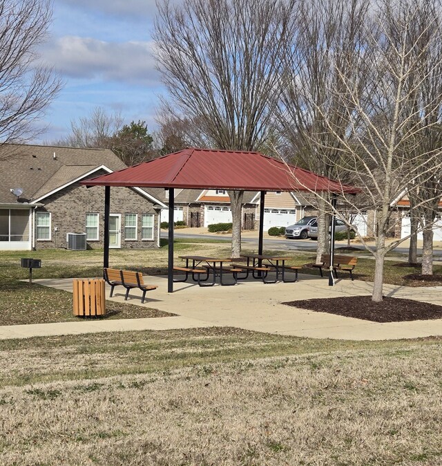 surrounding community featuring a gazebo and a lawn