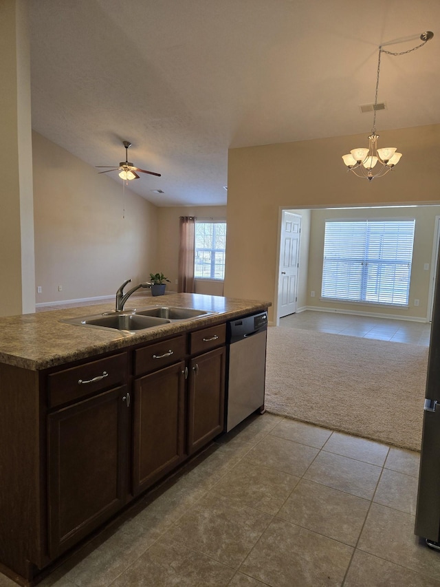 kitchen with dark brown cabinetry, dishwasher, light colored carpet, open floor plan, and a sink