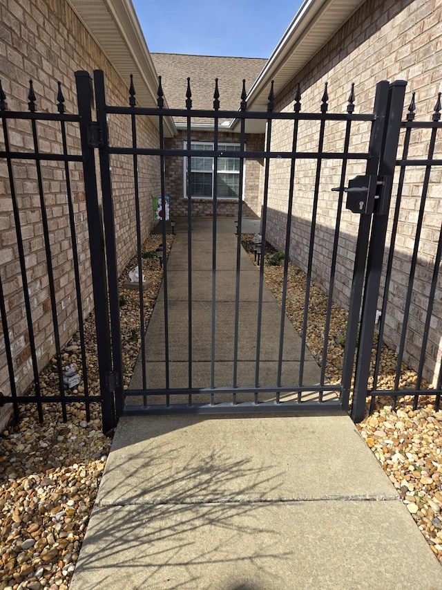 view of gate with fence