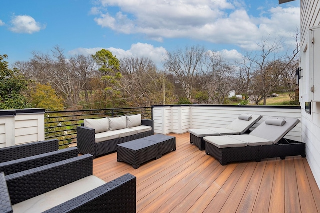 wooden deck with an outdoor hangout area