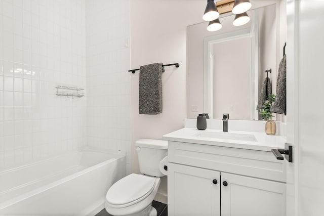 full bathroom with tiled shower / bath combo, vanity, and toilet