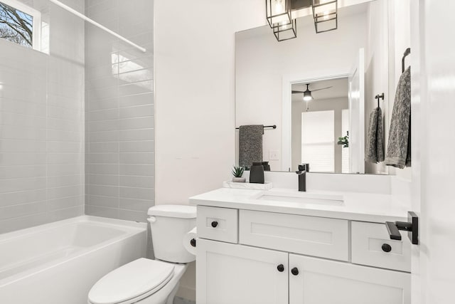 full bathroom with toilet, vanity, and tiled shower / bath