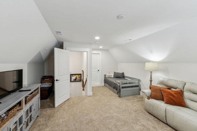 interior space featuring lofted ceiling, visible vents, light carpet, and recessed lighting