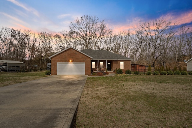 view of front of house featuring a garage and a lawn