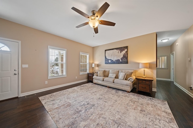 living room with dark hardwood / wood-style floors and ceiling fan