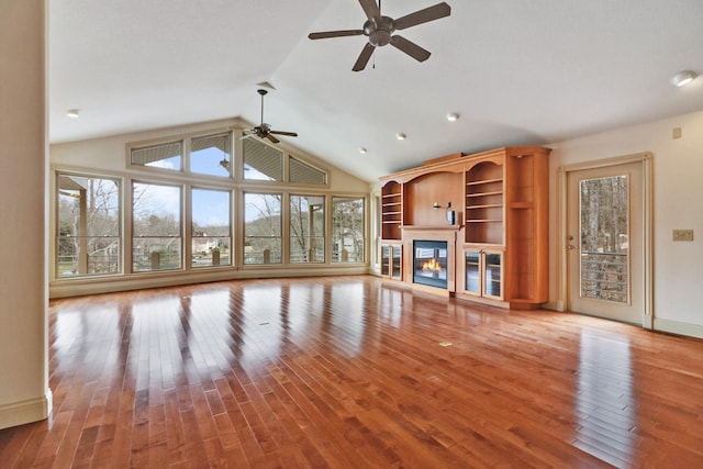 unfurnished living room with light hardwood / wood-style floors, lofted ceiling, and ceiling fan