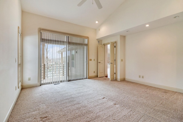 carpeted spare room with high vaulted ceiling and ceiling fan