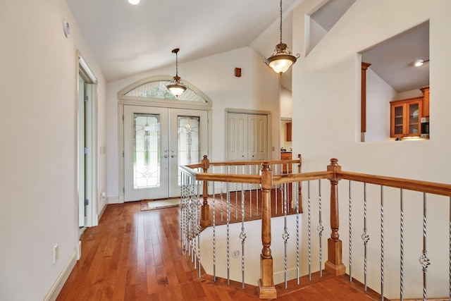 entryway featuring hardwood / wood-style flooring, french doors, and lofted ceiling