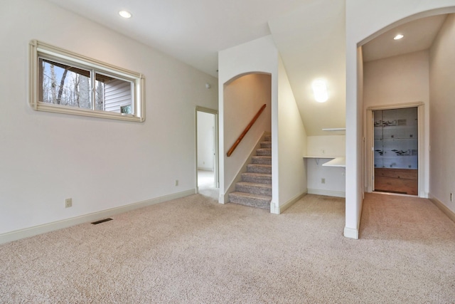 interior space featuring light colored carpet