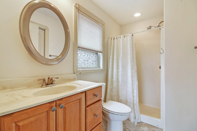 bathroom with toilet, vanity, tile patterned flooring, and a shower with shower curtain