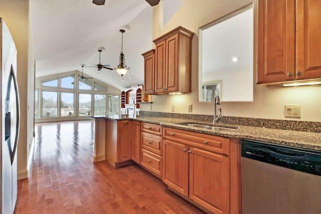 kitchen with decorative light fixtures, ceiling fan, stainless steel appliances, and sink