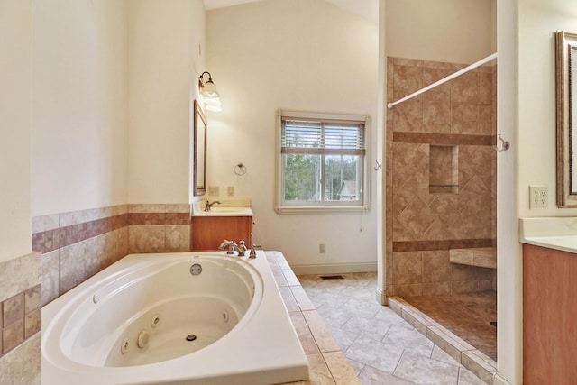 bathroom with vanity, independent shower and bath, and tile patterned flooring