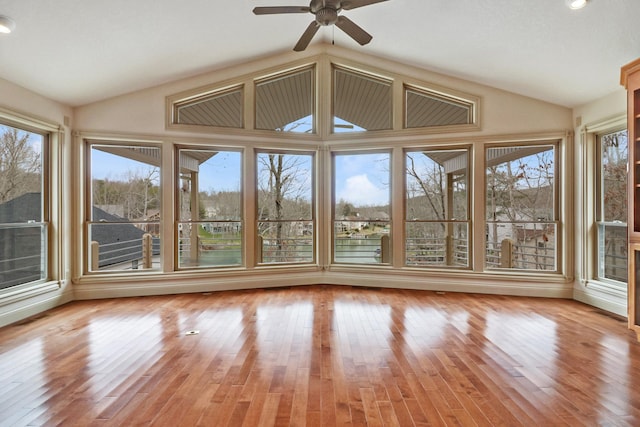 unfurnished sunroom featuring vaulted ceiling and ceiling fan