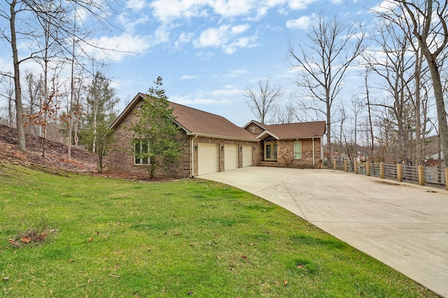 ranch-style home featuring a front yard and a garage