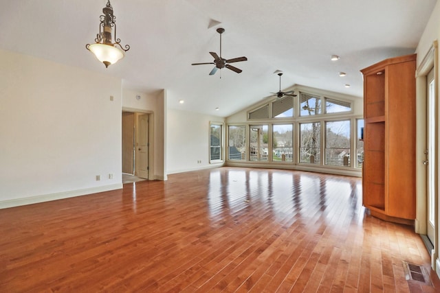 unfurnished living room with hardwood / wood-style floors, high vaulted ceiling, and ceiling fan