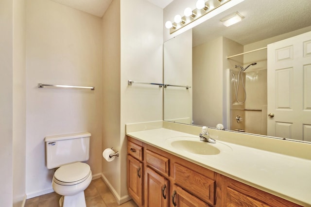 full bathroom featuring a textured ceiling, toilet, vanity, baseboards, and tile patterned floors