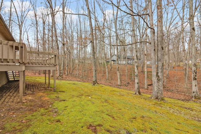 view of yard with a wooden deck