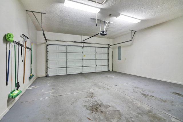 garage with electric panel, baseboards, and a garage door opener