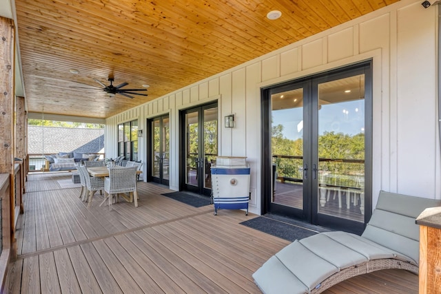 deck with ceiling fan and french doors