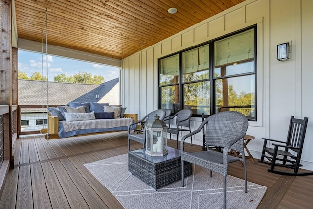 sunroom featuring wooden ceiling