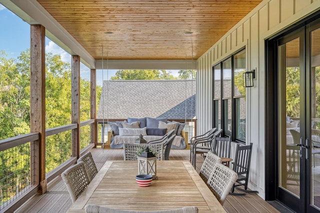 unfurnished sunroom featuring plenty of natural light and wood ceiling